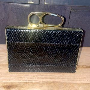 Statement clutch with optional gold strap.